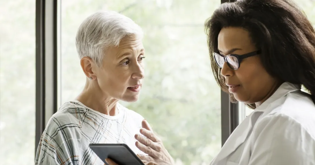 Healthcare professional consulting with a patient Healthcare professional consulting with a patient