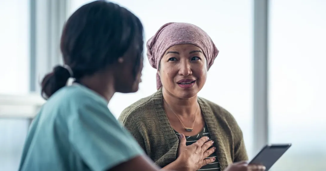 A woman with cancer is consulting her doctor. A woman with cancer is consulting her doctor.