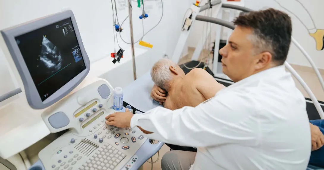 A doctor conducting a cardiac ultrasound. A doctor conducting a cardiac ultrasound.