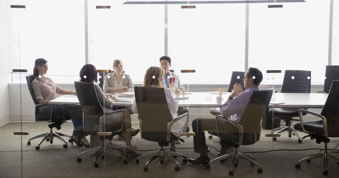 Executives at a conference table Executives at a conference table