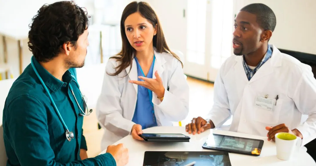 Doctors discussing imaging results. Doctors discussing imaging results.