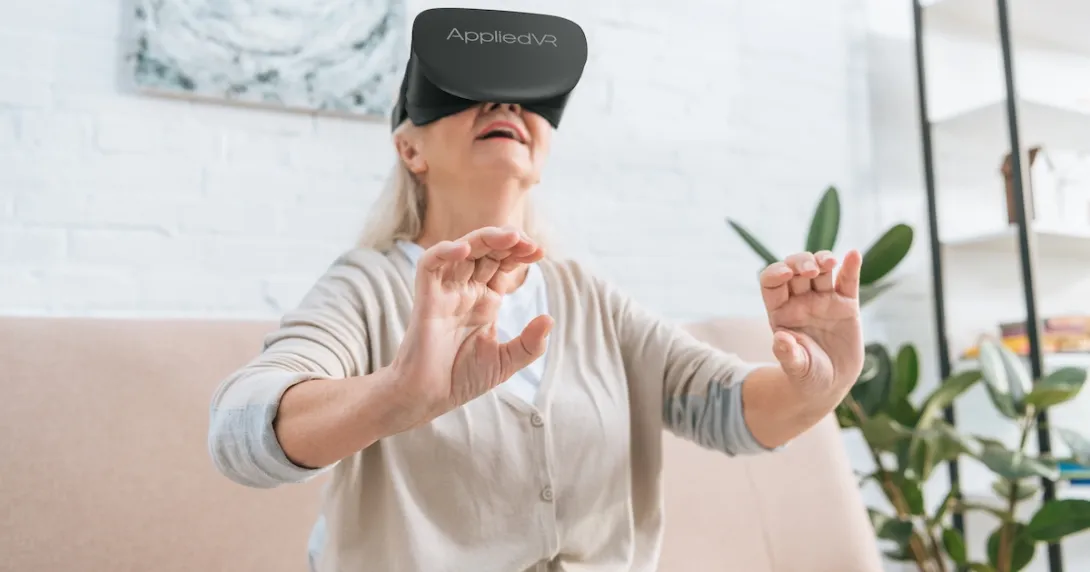 A woman using an AppliedVR headset at home