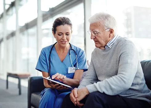 Provider gives options to patient while looking at a tablet or notepad Provider gives options to patient while looking at a tablet or notepad
