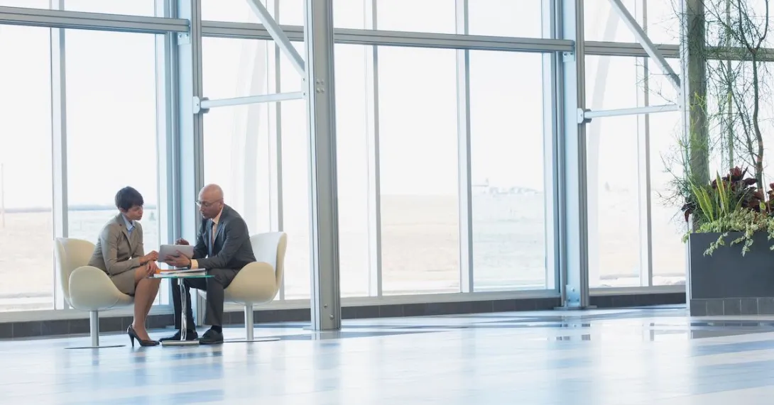 Two professionals meeting in an office. Two professionals meeting in an office.