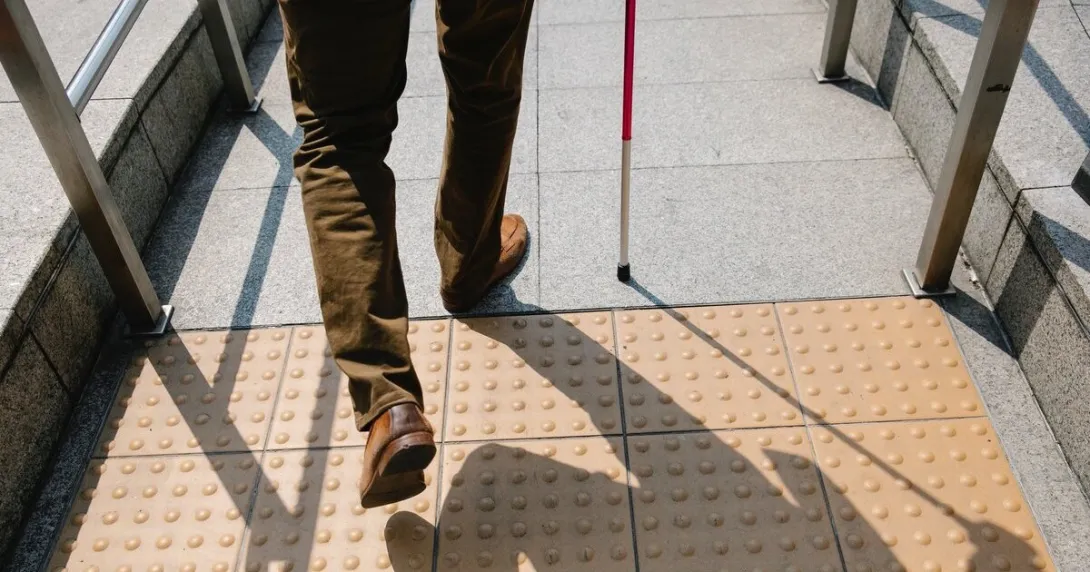 A person walking with cane