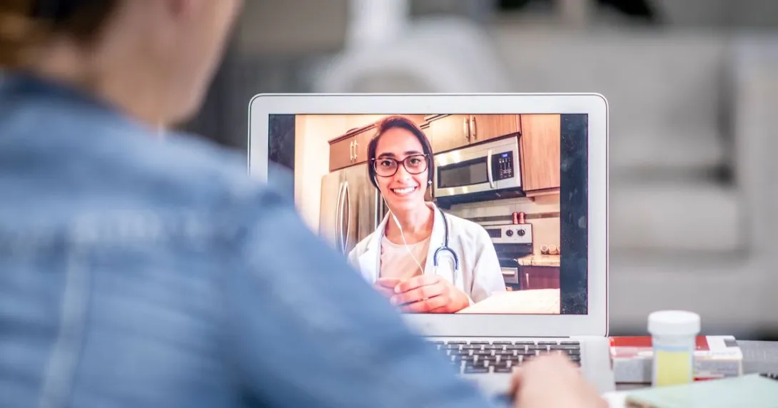 A patient talking to a provider via telehealth A patient talking to a provider via telehealth