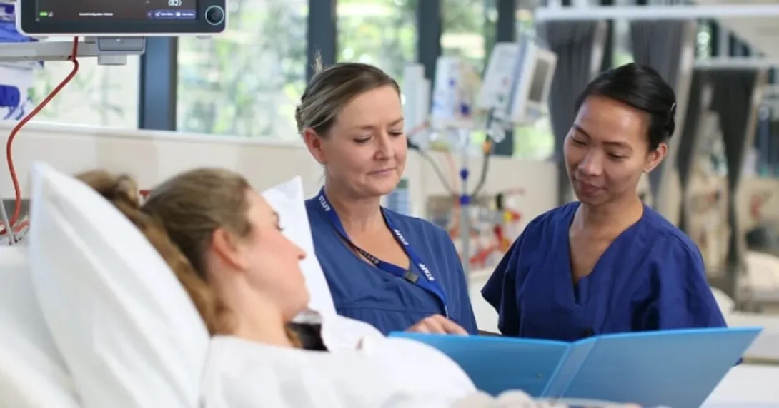 Virtus Health nurses assisting a patient in bed Virtus Health nurses assisting a patient in bed