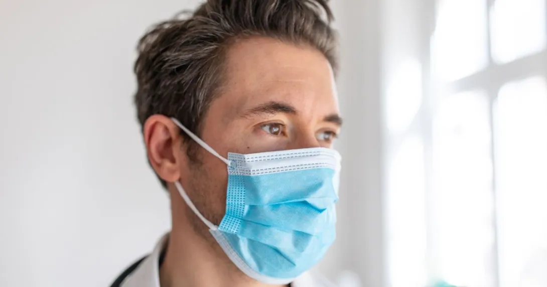 The face of a healthcare provider wearing a mask The face of a healthcare provider wearing a mask