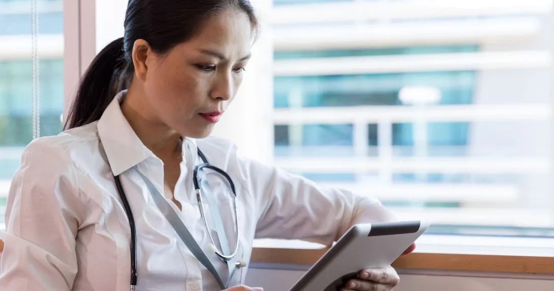 Healthcare provider on a tablet Healthcare provider on a tablet