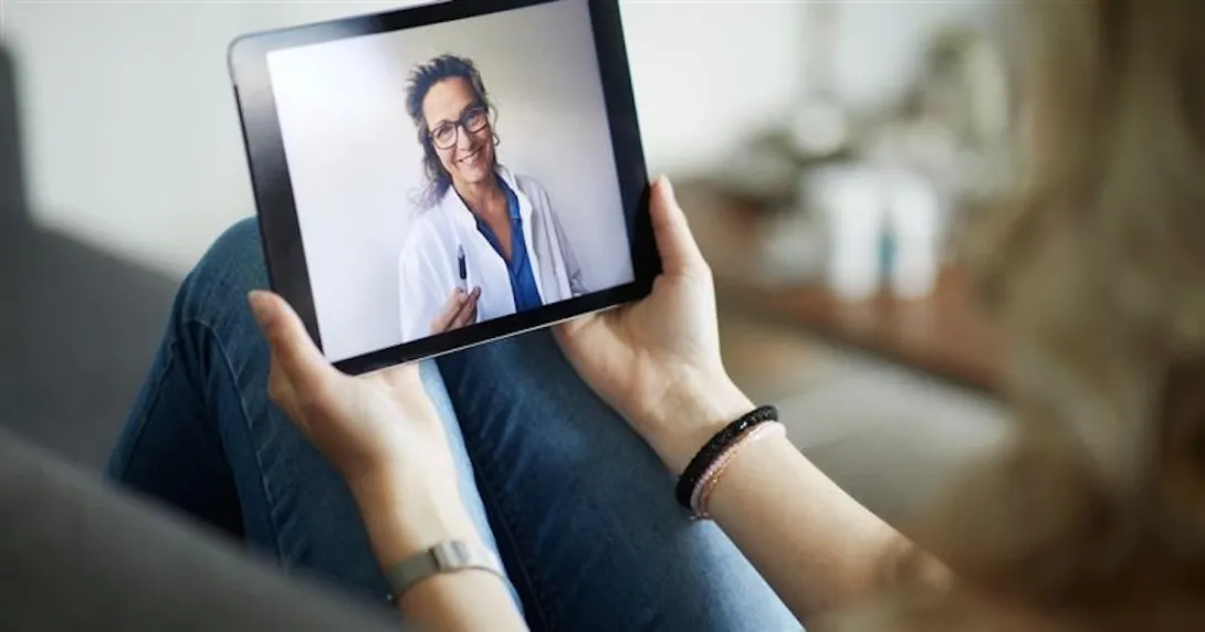 Person speaking to healthcare provider on a tablet Person speaking to healthcare provider on a tablet