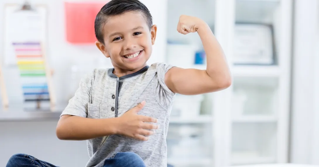 Person sitting in a clinic while flexing their arm muscles Person sitting in a clinic while flexing their arm muscles