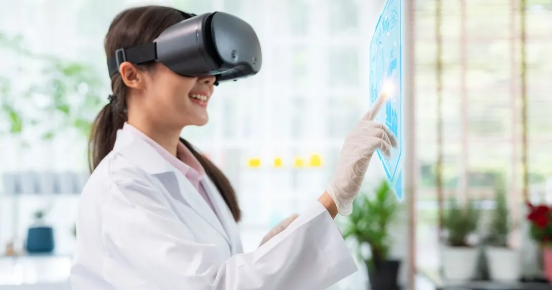 Healthcare provider wearing a virtual reality headset while touching a virtual screen Healthcare provider wearing a virtual reality headset while touching a virtual screen