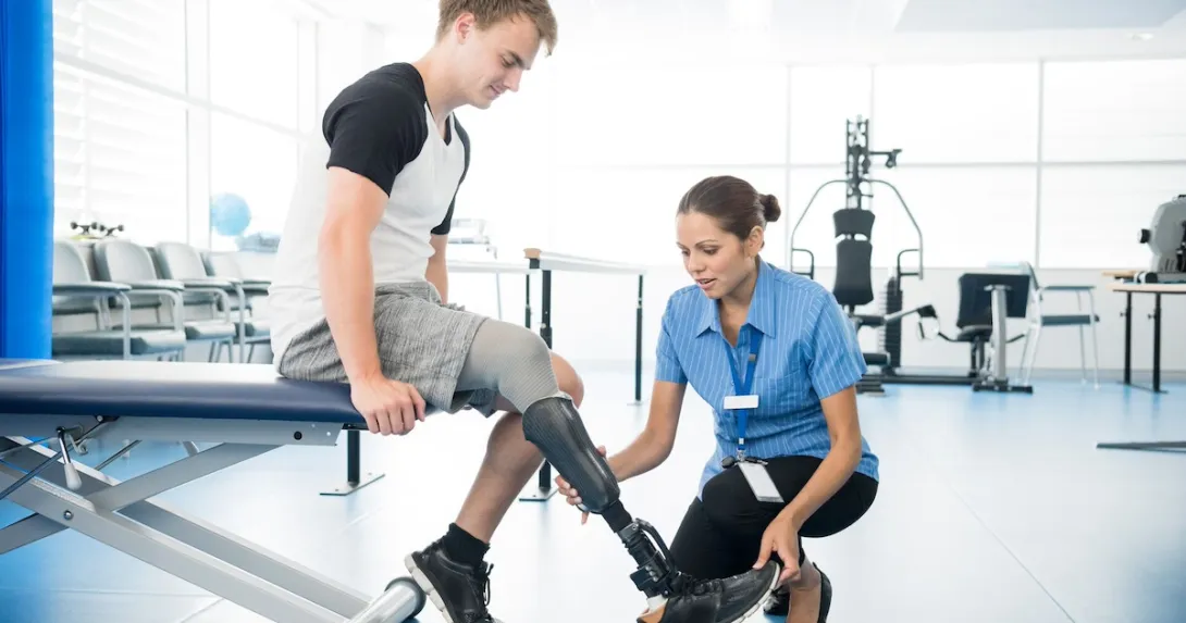 Amputee with a physical therapist