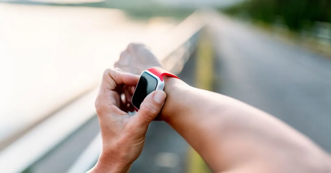 A person's arm with a smartwatch on their wrist A person's arm with a smartwatch on their wrist