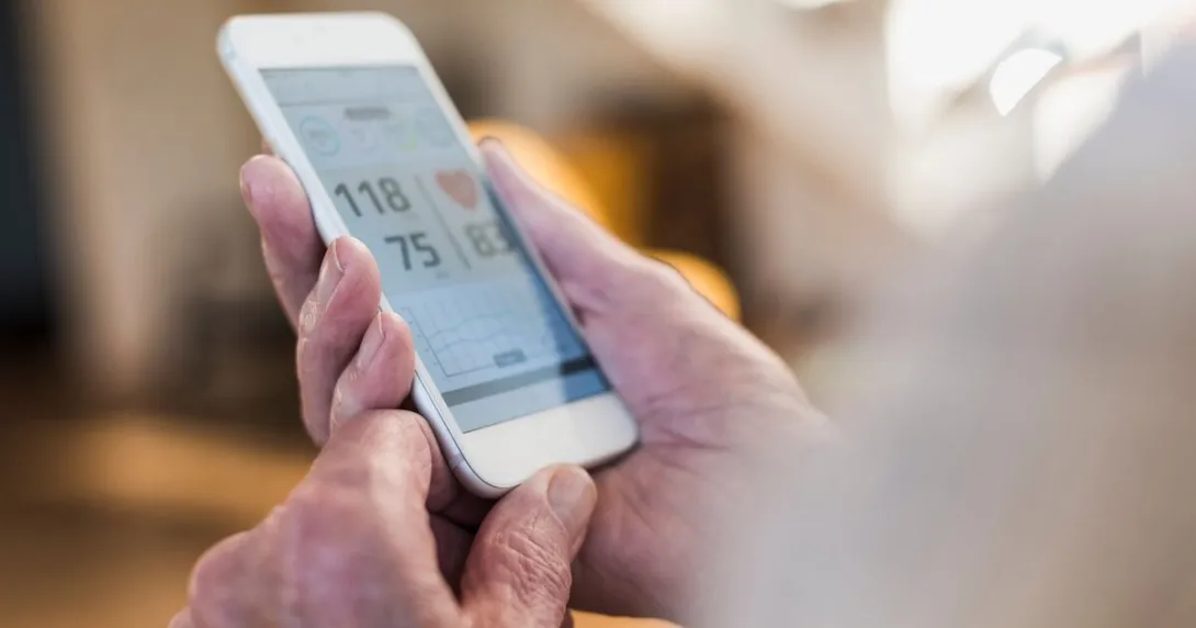 A user checks their vitals from a mobile health app