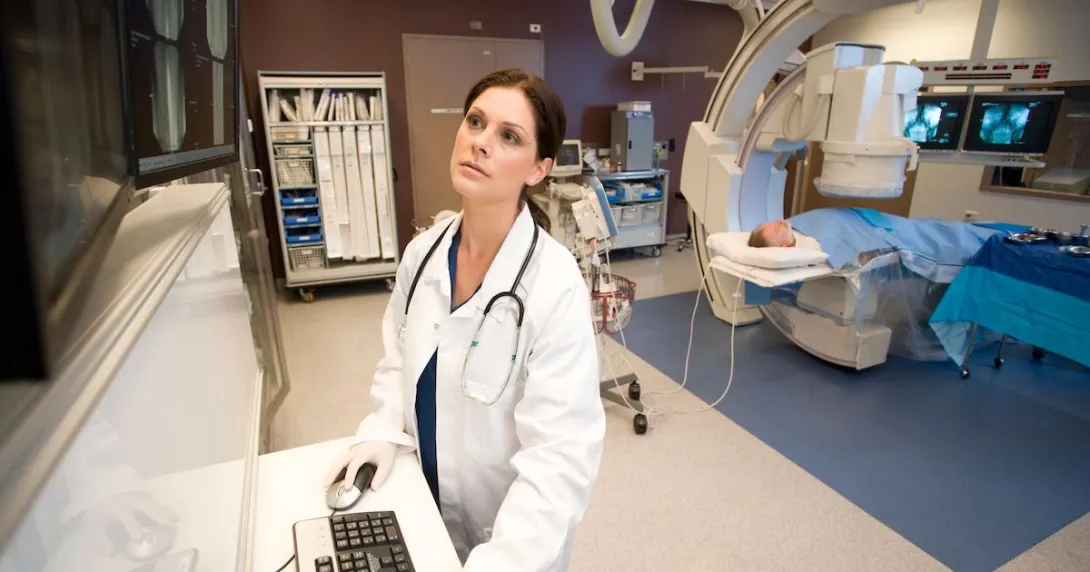 A doctor reviewing a patient's scan A doctor reviewing a patient's scan