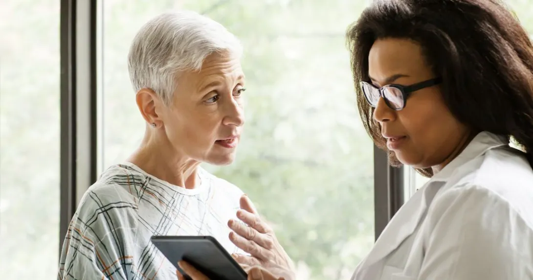 An elderly patient consulting with their doctor An elderly patient consulting with their doctor