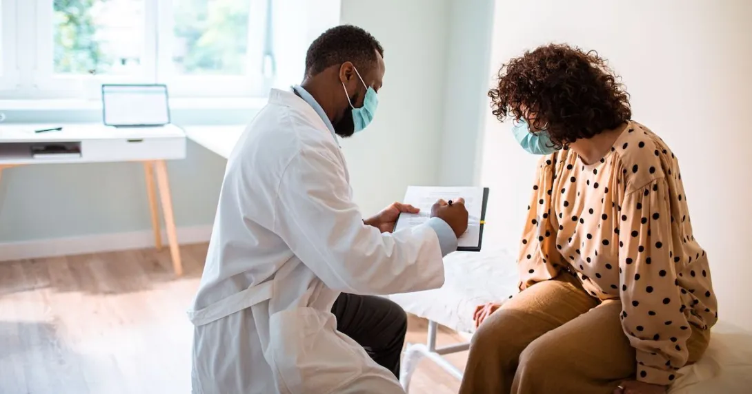 A woman talking to her doctor